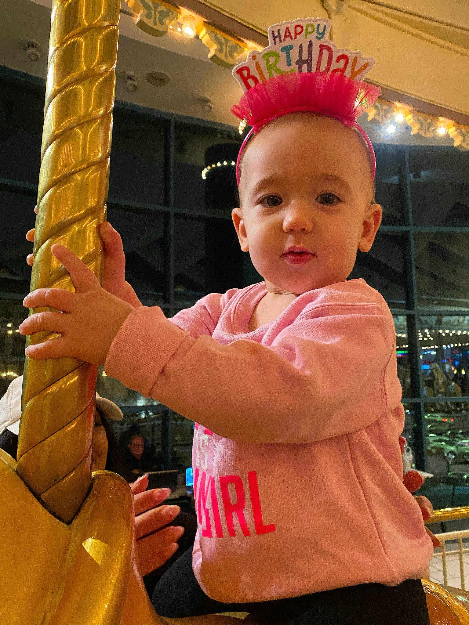 Ellianna is registered to the contest to win money with this photo: baby, baby_toddler_clothing, child, finger, fun, gesture, happy, leisure, orange, party_supply, person, play, recreation, sleeve, smile, standing, t_shirt, thumb, toddler, under_exposed