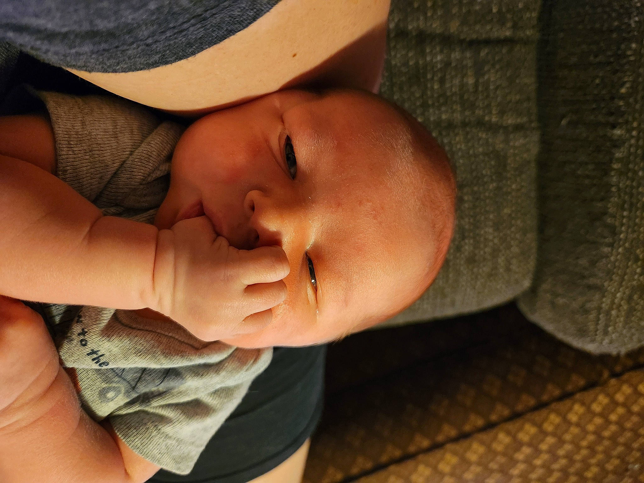 Zachary is registered to the contest to win money with this photo: baby, baby_toddler_clothing, cheek, chin, comfort, finger, gesture, happy, hat, headgear, human_body, lip, mouth, nail, neck, nose, person, skin, sun_hat, toddler