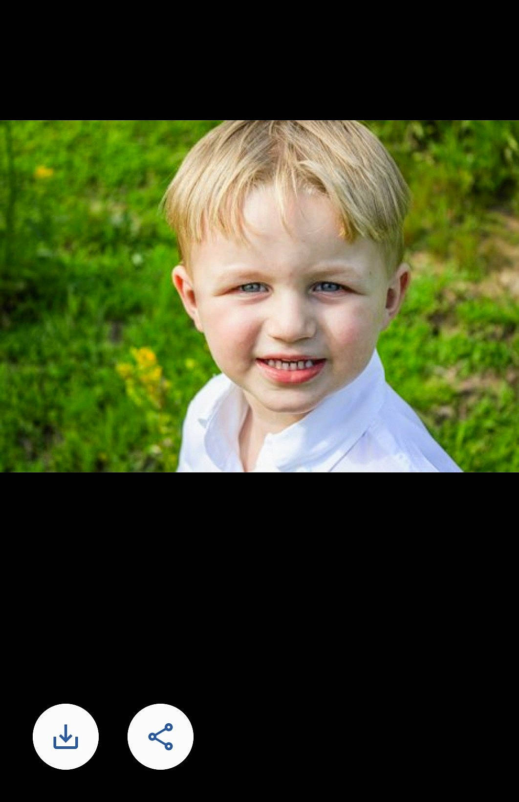 Rowan is registered to the contest to win money with this photo: child, chin, dress_shirt, electric_blue, flash_photography, font, formal_wear, fun, gesture, grass, happy, joy, laugh, people_in_nature, person, photo_caption, plant, portrait_photography, sitting, sleeve