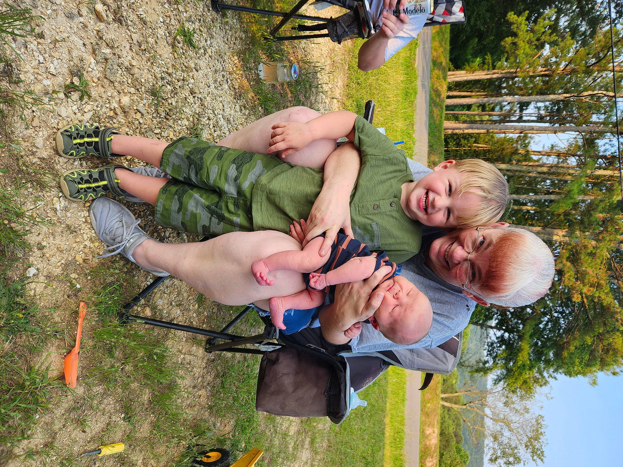 Rowan is registered to the contest to win money with this photo: adventure, child, event, fun, grass, happy, joy, leg, leisure, people_in_nature, person, plant, recreation, shorts, smile, thigh, toddler, tree, vacation, walking_shoe