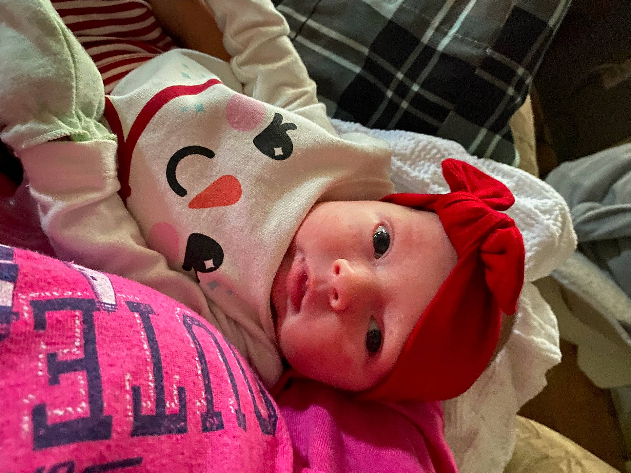 Adaline joined the competition — help win amazing prizes! baby, baby_toddler_clothing, carmine, cheek, child, comfort, fur, happy, hat, headwear, linens, pattern, person, pink, plaid, room, sleeve, smile, tartan, toddler