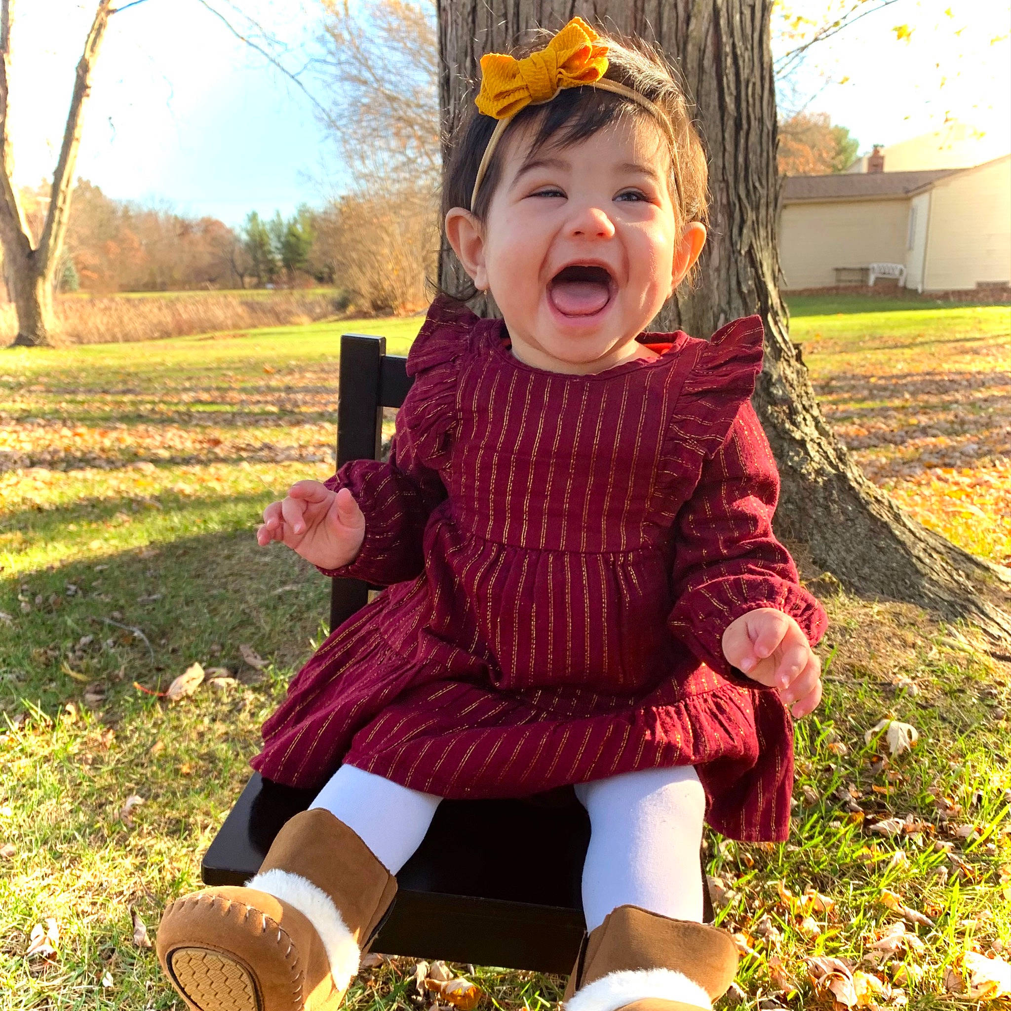 Anneliese is registered to the contest to win money with this photo: baby_toddler_clothing, child, dress, eye, face, grass, green, happy, hat, head, leaf, people_in_nature, person, plant, sky, sleeve, smile, summer, sunlight, toddler