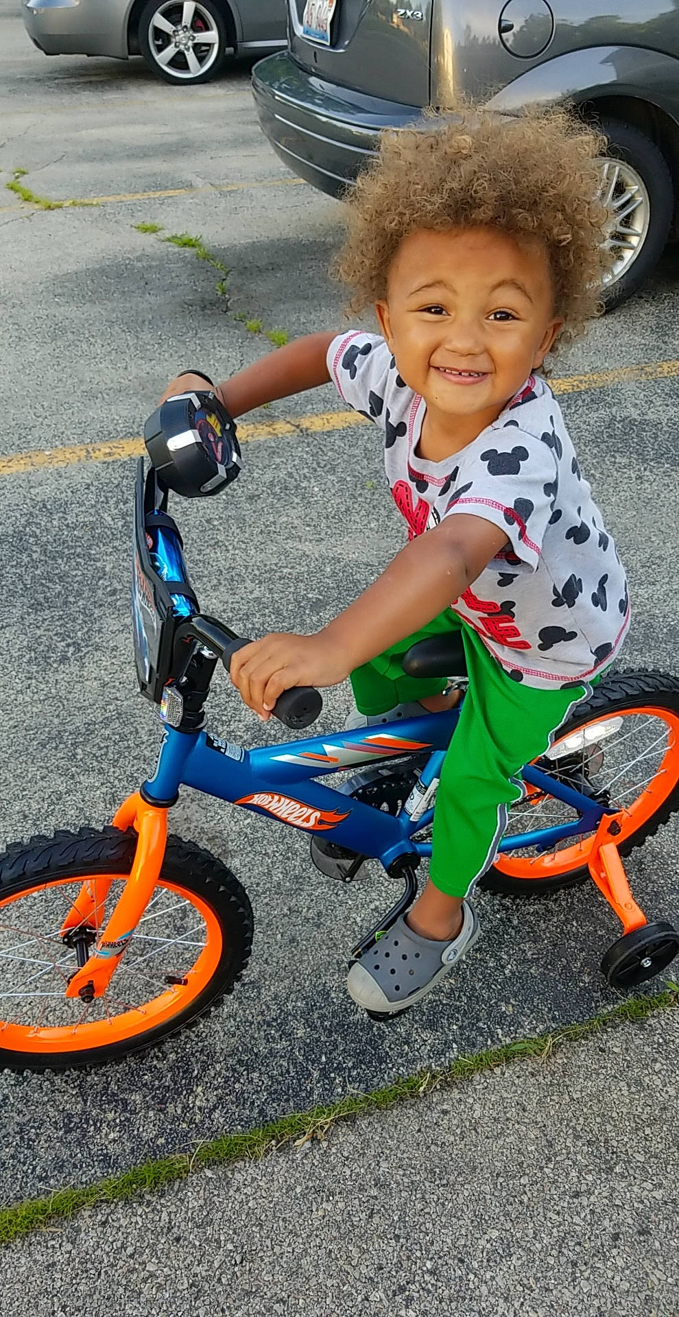 Xameer is registered to the contest to win money with this photo: bicycle, bicycle_accessory, bicycle_drivetrain_part, bicycle_handlebar, bicycle_part, bicycle_wheel, child, joy, person, play, recreation, sports_equipment, toddler, training_wheels, vehicle, wheel