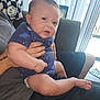 Osiris is registered to the contest to win money with this photo: architecture, baby, bodypart, building, clothing, couch, cushion, face, finger, furniture, hand, head, homedecor, indoors, livingroom, pants, person, photography, portrait, sitting