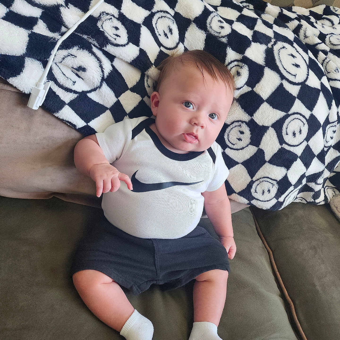 Osiris is registered to the contest to win money with this photo: baby, bed, bedroom, clothing, couch, cushion, face, furniture, head, homedecor, hosiery, indoors, person, photography, pillow, portrait, shorts, sitting, sock, t_shirt