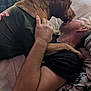 Sonny Boy is registered to the contest to win money with this photo: affection, animal, arm, bed, blanket, casual, clothing, comfort, cuddle, dog, face, friendship, human, indoor, licking, love, man, pet, pillow, resting
