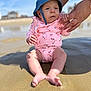 adult, baby, beach, child, cute, expression, foot, hand, hat, leg, outdoor, person, sand, skin, summer, sunny, support, swimsuit, vacation, water