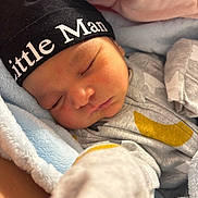 Adam joined the competition — help win amazing prizes! baby, sleeping, hat, blanket, cozy, cute, infant, clothing, closeup, soft, peaceful, newborn, person, face, rest, warm, indoor, child, nap, adorable