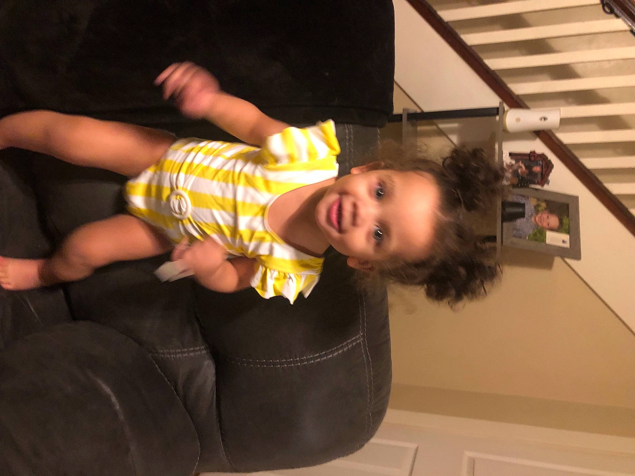 Zariyah is registered to the contest to win money with this photo: baby_toddler_clothing, cheek, child, comfort, elbow, finger, flooring, fun, happy, human_leg, joy, light_switch, mouth, person, room, sitting, smile, t_shirt, thigh, thumb