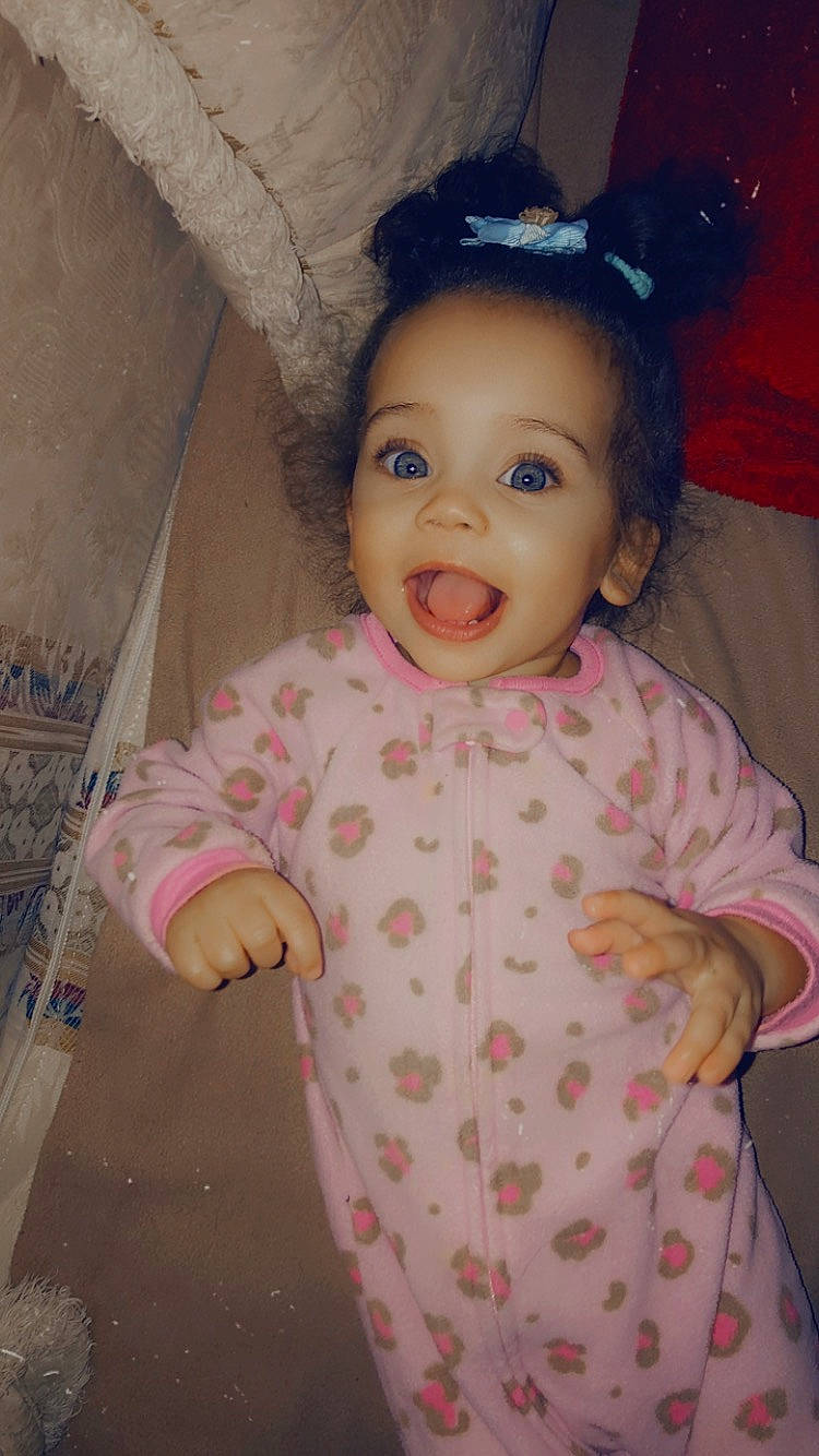 Zariyah joined the competition — help win amazing prizes! arm, baby, baby_toddler_clothing, cheek, eye, face, gesture, happy, head, human_body, iris, lip, nose, organ, person, pink, purple, skin, sleeve, smile