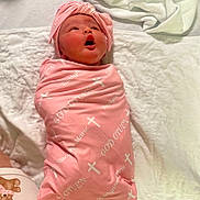 Raelynne joined the competition — help win amazing prizes! newborn, baby, pink_blanket, head_wrap, wrapped, quilted_bed, white_bedspread, infant, cute, lying_down, soft_texture, clothing, sleepwear, toddler, person, portrait, indoors, baby_girl, resting, cozy