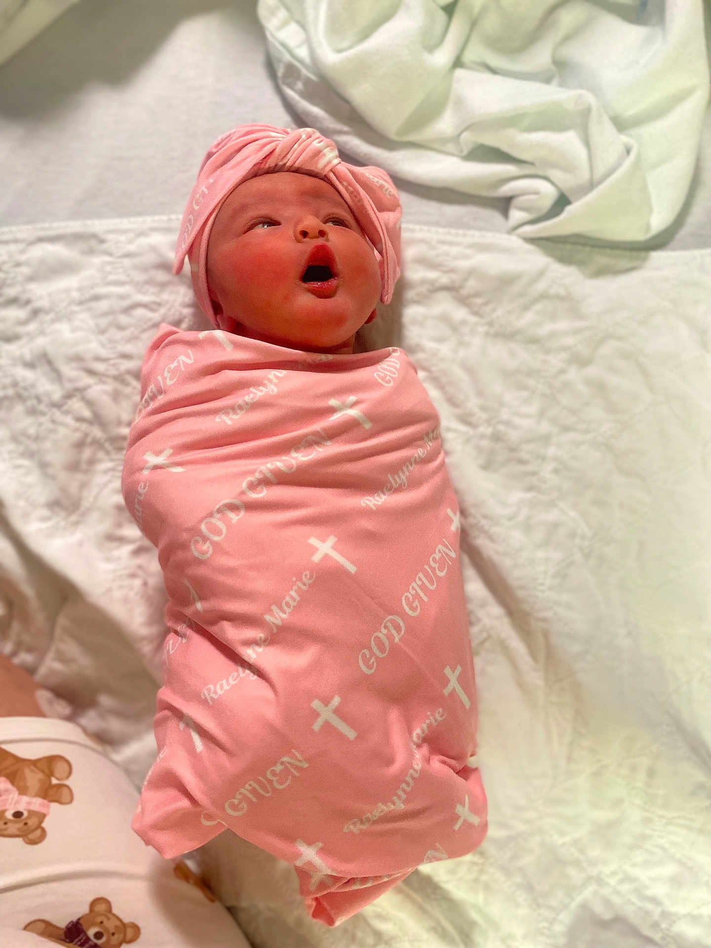 Raelynne joined the competition — help win amazing prizes! newborn, baby, pink_blanket, head_wrap, wrapped, quilted_bed, white_bedspread, infant, cute, lying_down, soft_texture, clothing, sleepwear, toddler, person, portrait, indoors, baby_girl, resting, cozy