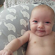 Jewlez joined the competition — help win amazing prizes! baby, infant, child, smiling, portrait, close_up, lying_down, diaper, blanket, bedding, elephant_pattern, nursery, home, indoors, face, eyes, skin, happy, cute, photography