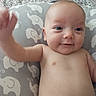 Jewlez is registered to the contest to win money with this photo: baby, infant, child, portrait, smiling, lying_down, diaper, bare_chested, elephant_pattern, changing_mat, nursery, indoors, close_up, face, eyes, hand, reaching, happy, candid, photography