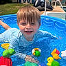 toddler, child, pool, water, toy, float, summer, outdoor, play, smile, happy, blue, backyard, plastic, swimwear, wet_hair, daylight, fun, recreation, person