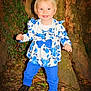 élena a rejoint le concours — aidez-le/la à gagner de superbes lots ! child, toddler, smiling, outdoor, tree, leaves, blue_clothing, pants, shirt, boots, nature, forest, standing, happy, person, flora, trunk, ground, cute, portrait