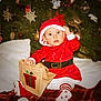 baby, christmas, holiday, festive, santa_claus, red_clothing, gift_bag, christmas_tree, ornaments, decorations, toddler, striped_tights, white_background, plush, cute, indoors, celebration, holiday_season, child, festive_outfit