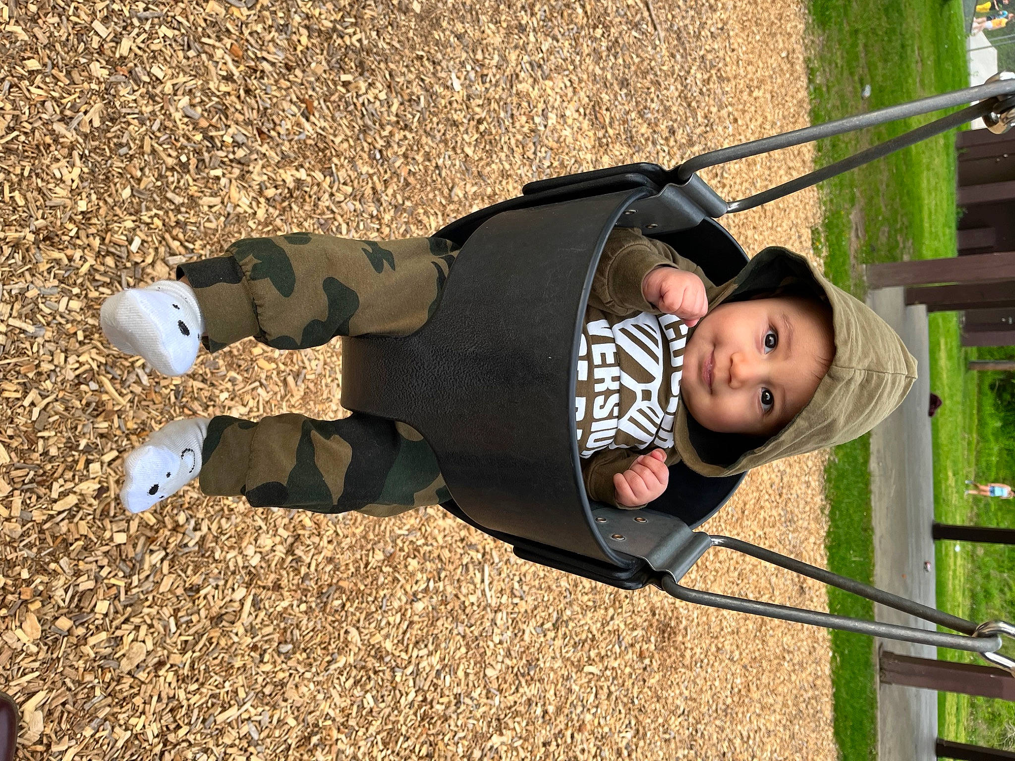 Abraham is registered to the contest to win money with this photo: baby, baby_toddler_clothing, child, city, fun, grass, happy, headwear, joy, leisure, outdoor_play_equipment, people_in_nature, person, plant, play, playground, recreation, shadow, soil, swing