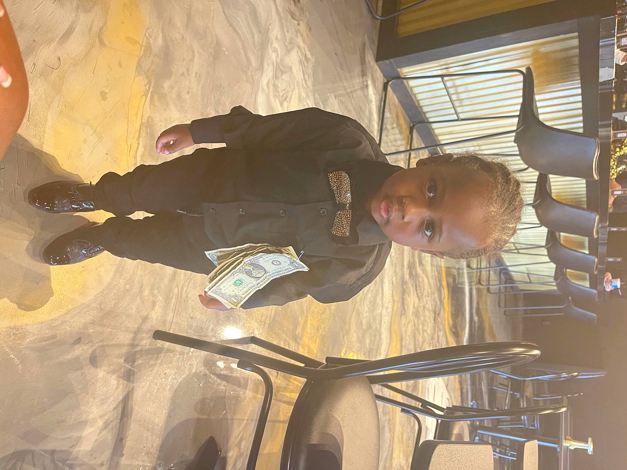 Joseph is registered to the contest to win money with this photo: automotive_lighting, ceiling, fun, person, personal_protective_equipment, room, sports_equipment, tints_and_shades, window, wood