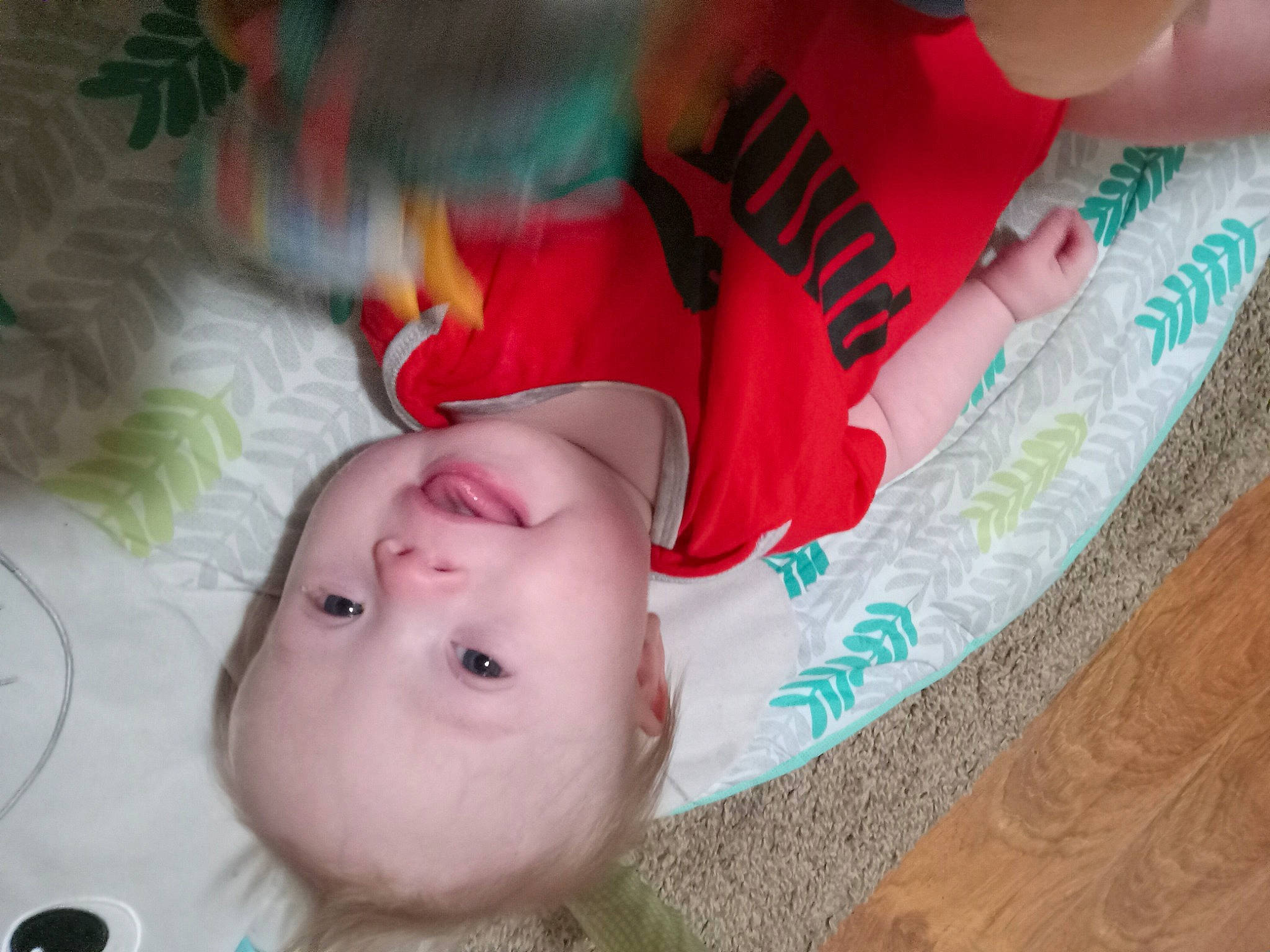 Conner is registered to the contest to win money with this photo: baby, baby_toddler_clothing, cheek, child, comfort, eyelash, facial_expression, fun, grass, happy, iris, lip, mouth, nose, pattern, person, pink, skin, toddler