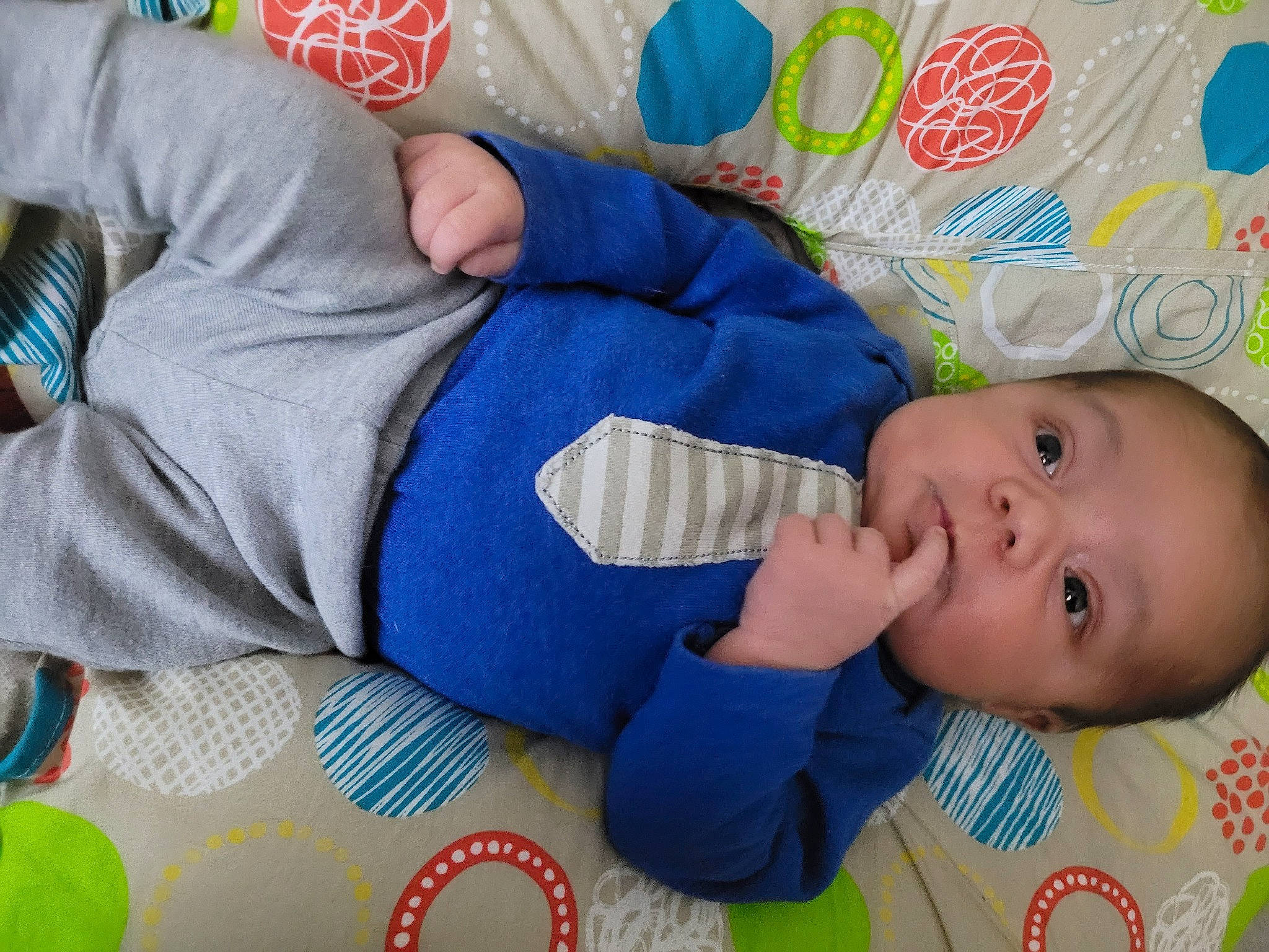 David is registered to the contest to win money with this photo: baby, baby_products, baby_safety, baby_sleeping, baby_toddler_clothing, baby_toys, blue, carmine, cheek, child, comfort, electric_blue, linens, pattern, person, room, skin, sleeve, textile, toddler