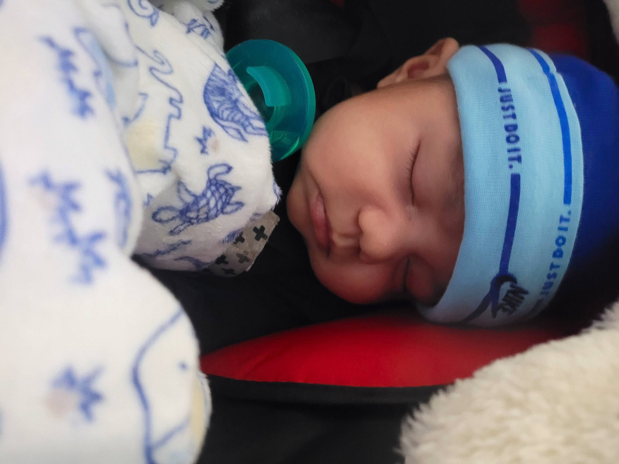 David joined the competition — help win amazing prizes! arm, baby, baby_sleeping, baby_toddler_clothing, cap, cheek, comfort, drinkware, eye, eyelash, finger, hand, headwear, helmet, human_body, leg, nose, person, product, skin