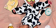 Zaylie is registered to the contest to win money with this photo: baby, infant, cucumber_slices, bathrobe, cow_pattern, pink_blanket, baby_bath_products, johnsons, wooden_sign, 3_months, cute, relaxation, skin_care, child, hooded_garment, soft_texture, lying_down, toddler, spa_day, adorable