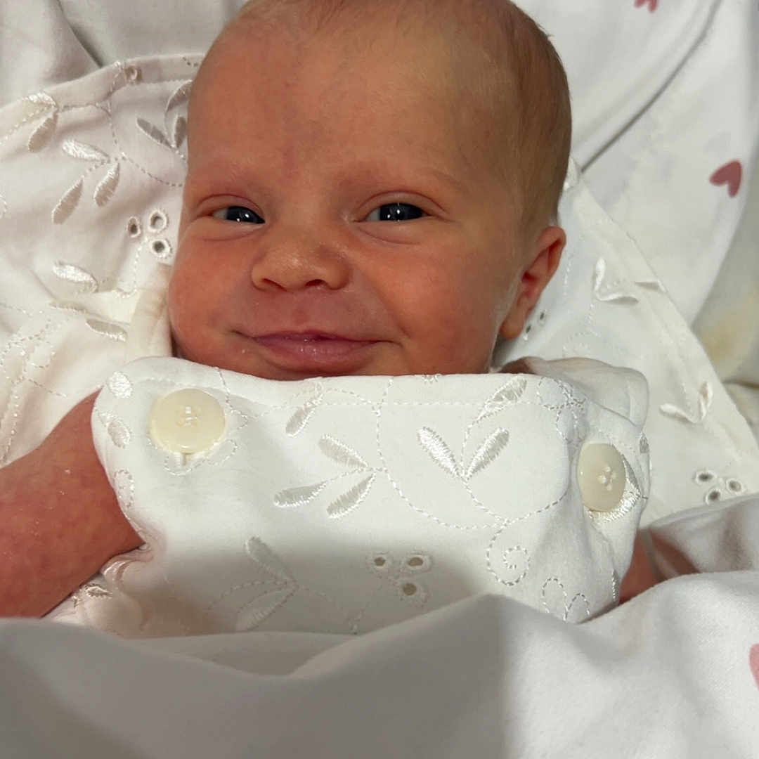 Isabelle-Rose joined the competition — help win amazing prizes! baby, bed, blanket, button, child, comfort, cute, fabric, face, happy, heart, infant, newborn, pattern, portrait, skin, sleeping_area, smile, soft, white