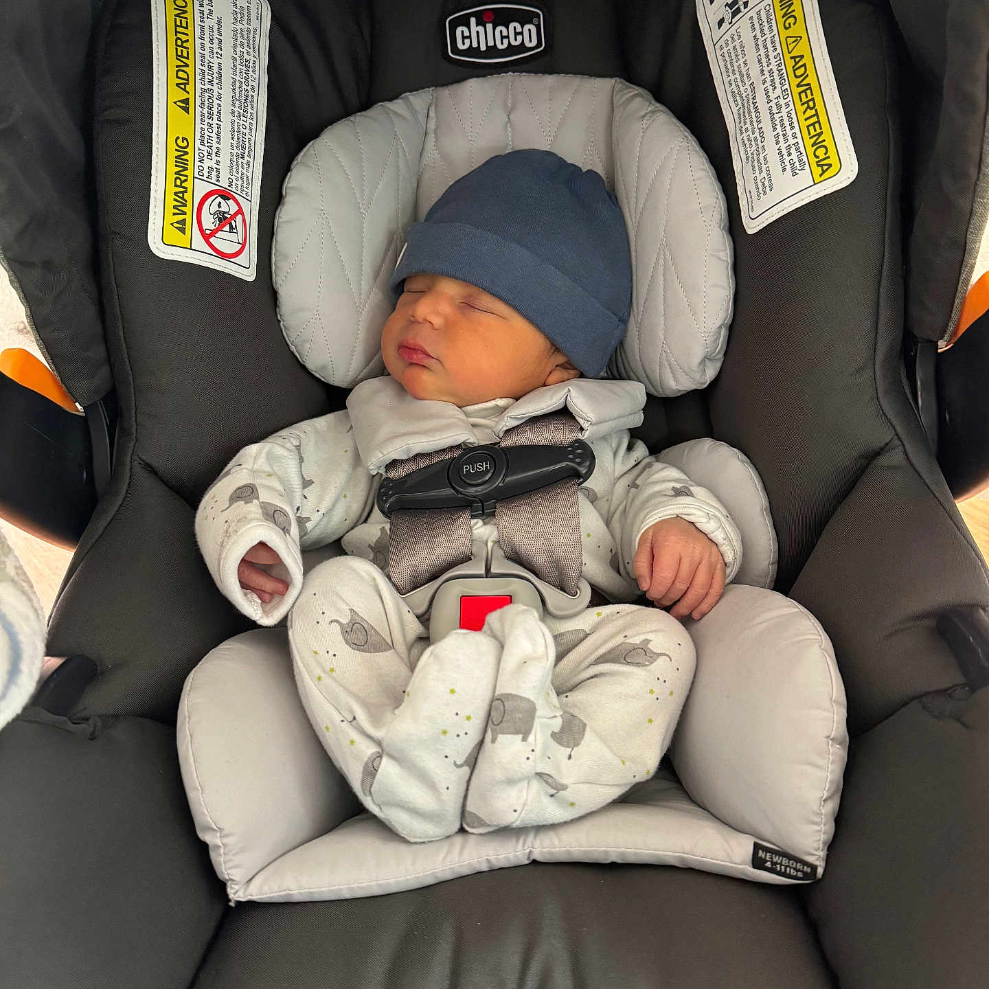 Joldy is registered to the contest to win money with this photo: newborn, baby, car_seat, chicco, sleeping, infant, hat, pajamas, safety_harness, child, cute, resting, indoors, seat, soft, small, peaceful, comfort, sleep, bundle