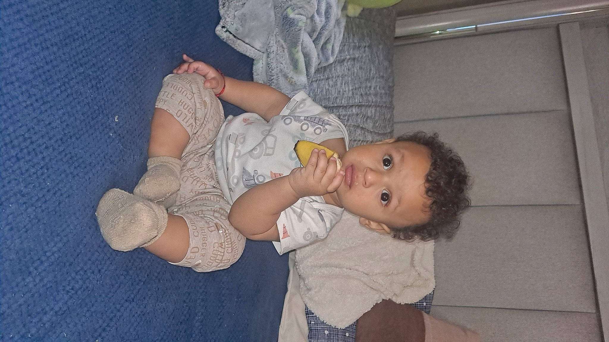 Emmanuel joined the competition — help win amazing prizes! arm, baby, baby_toddler_clothing, cheek, child, comfort, elbow, finger, fun, gesture, hat, human_leg, lap, mouth, person, sitting, skin, sock, thigh, toddler