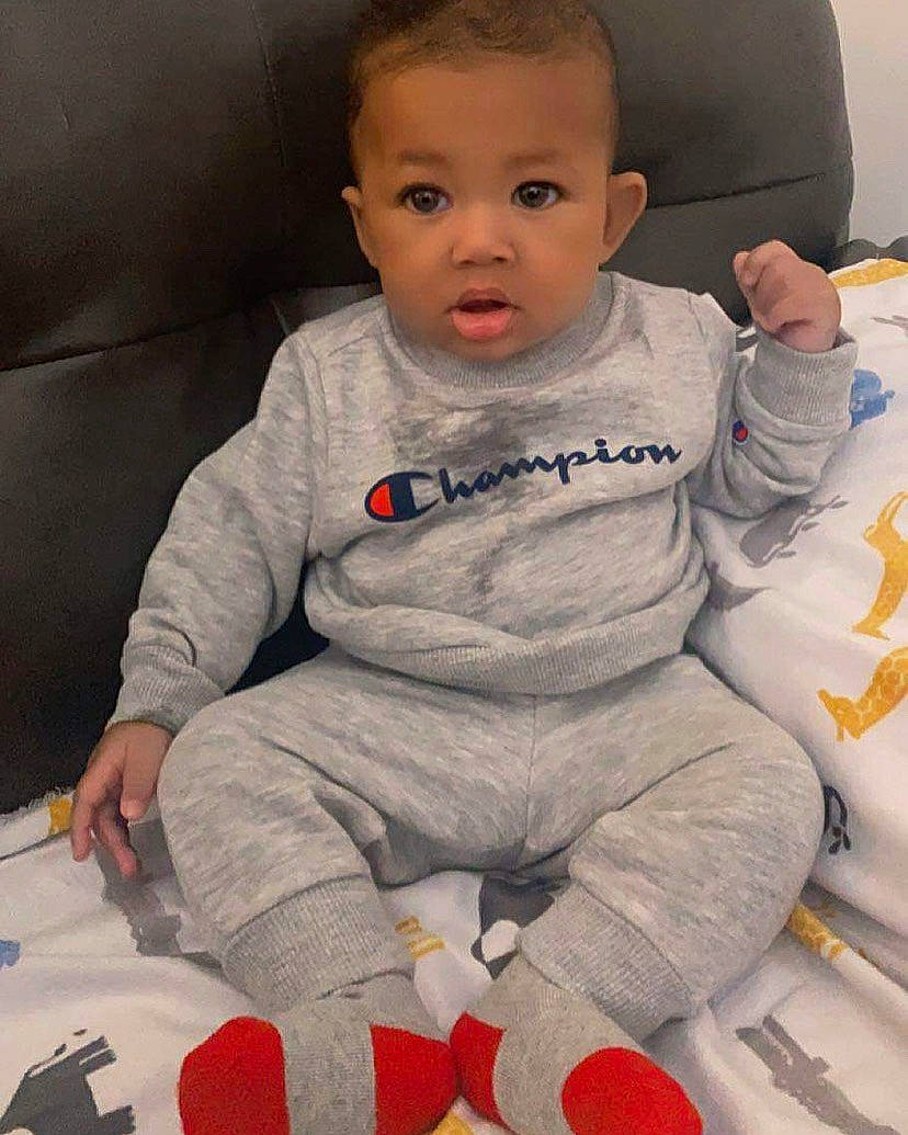 David Jr joined the competition — help win amazing prizes! baby, baby_toddler_clothing, chair, cheek, child, chin, comfort, eye, face, finger, happy, head, human_body, iris, lip, nose, person, sitting, skin, sleeve