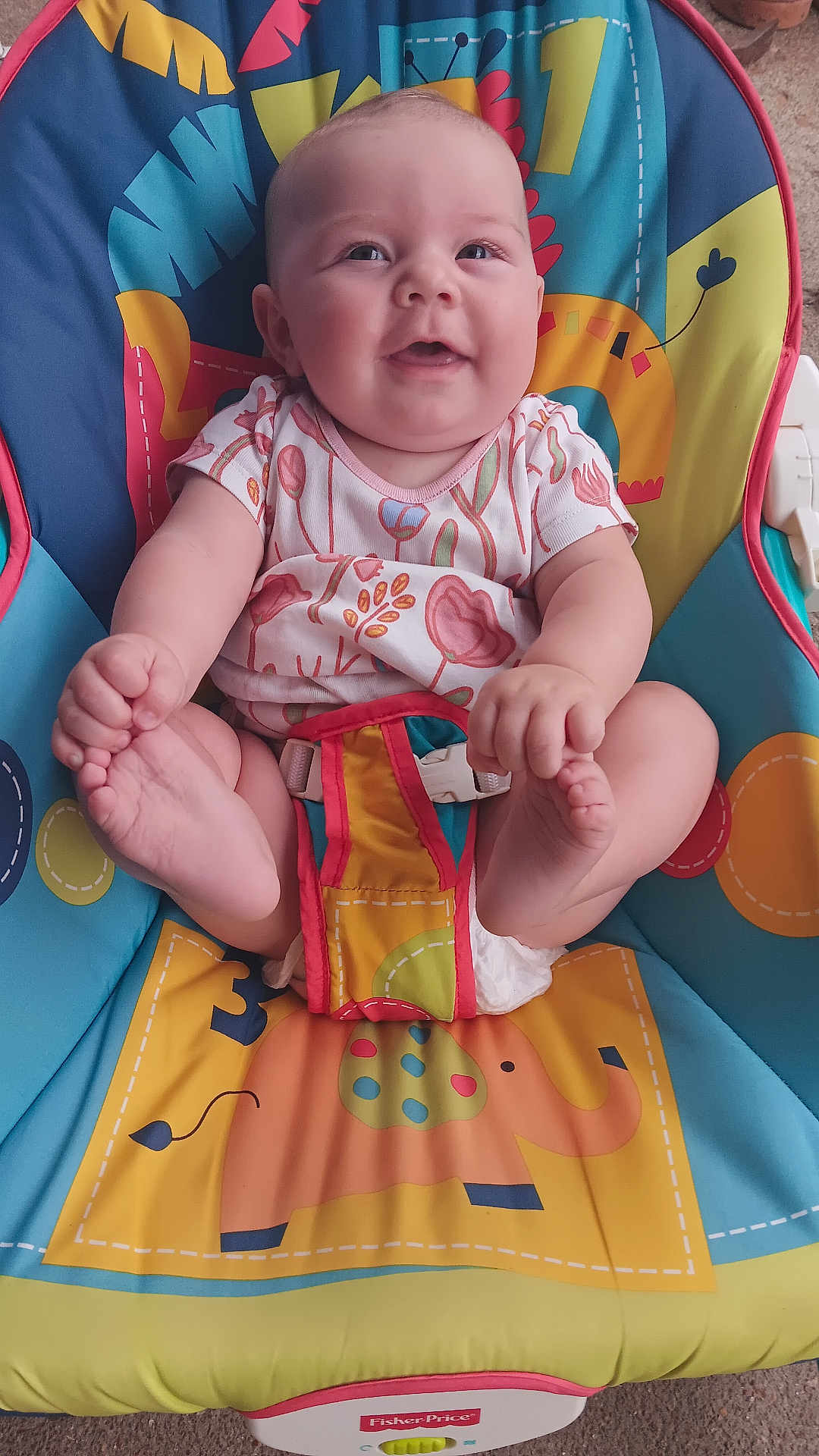 Leenna joined the competition — help win amazing prizes! animal_print, baby, baby_seat, child, colorful, comfort, cute, fisher_price, foot_holding, happy, indoors, infant, onesie, playful, portrait, seat_belt, sitting, smiling, toy, young_child