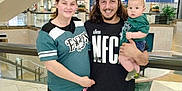 Kemp joined the competition — help win amazing prizes! family, shopping_mall, woman, man, baby, casual_clothing, smile, portrait, indoor, railing, stairs, people, child, young_adult, holding, shorts, tshirt, curly_hair, floor, happy