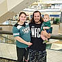Kemp joined the competition — help win amazing prizes! family, shopping_mall, woman, man, baby, casual_clothing, smile, portrait, indoor, railing, stairs, people, child, young_adult, holding, shorts, tshirt, curly_hair, floor, happy