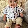 Zayden joined the competition — help win amazing prizes! baby, child, smiling, sitting, couch, shirt, pants, indoors, home, cozy, cute, happy, face, feet, furniture, infant, portrait, person, young, comfortable
