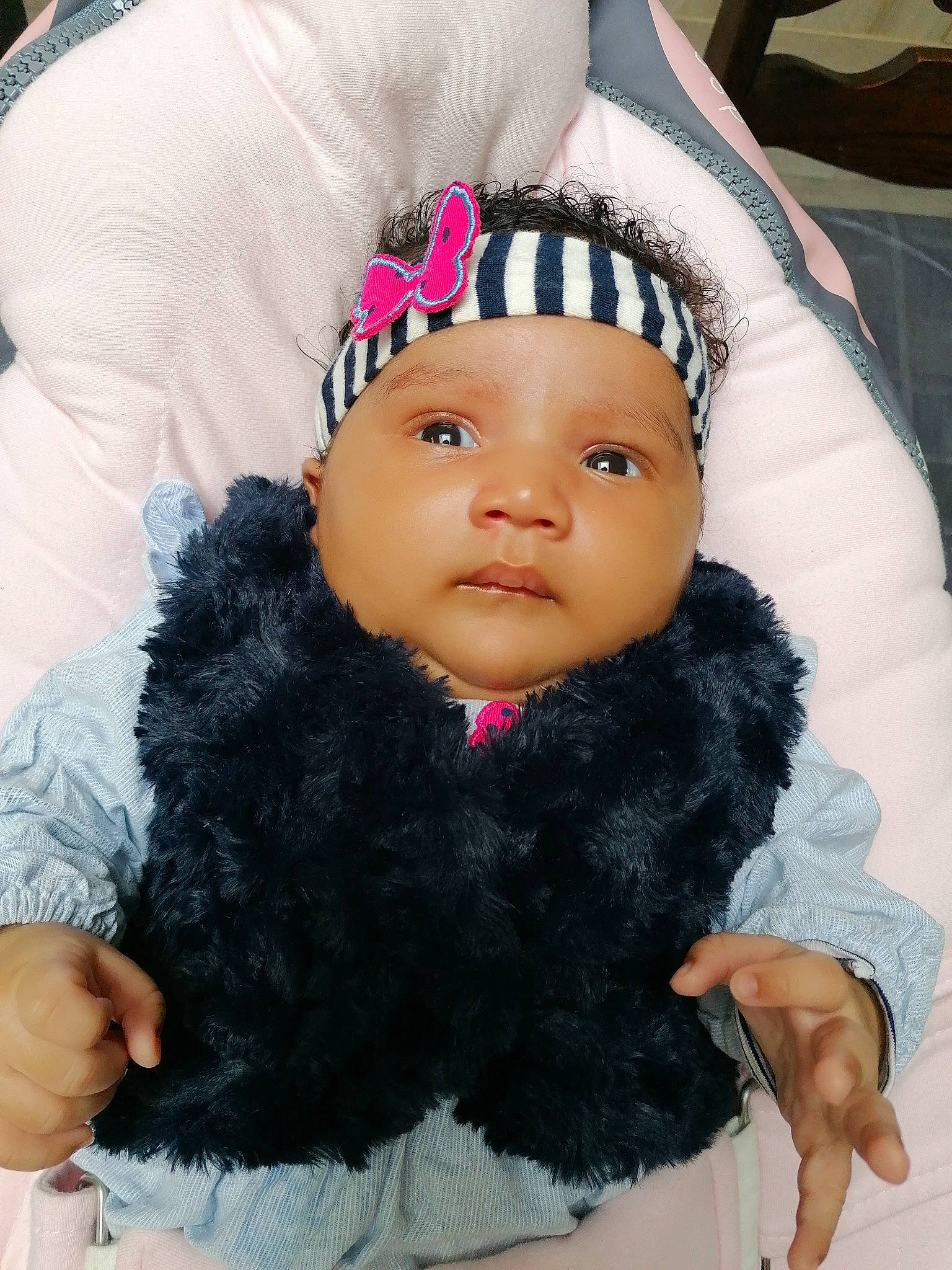 Brianna participe au concours pour gagner de l'argent avec cette photo : baby, baby_toddler_clothing, black_hair, cap, child, costume_hat, eye, eyelash, fashion_accessory, finger, fur, gesture, hand, happy, head, headgear, headwear, person, pink, skin