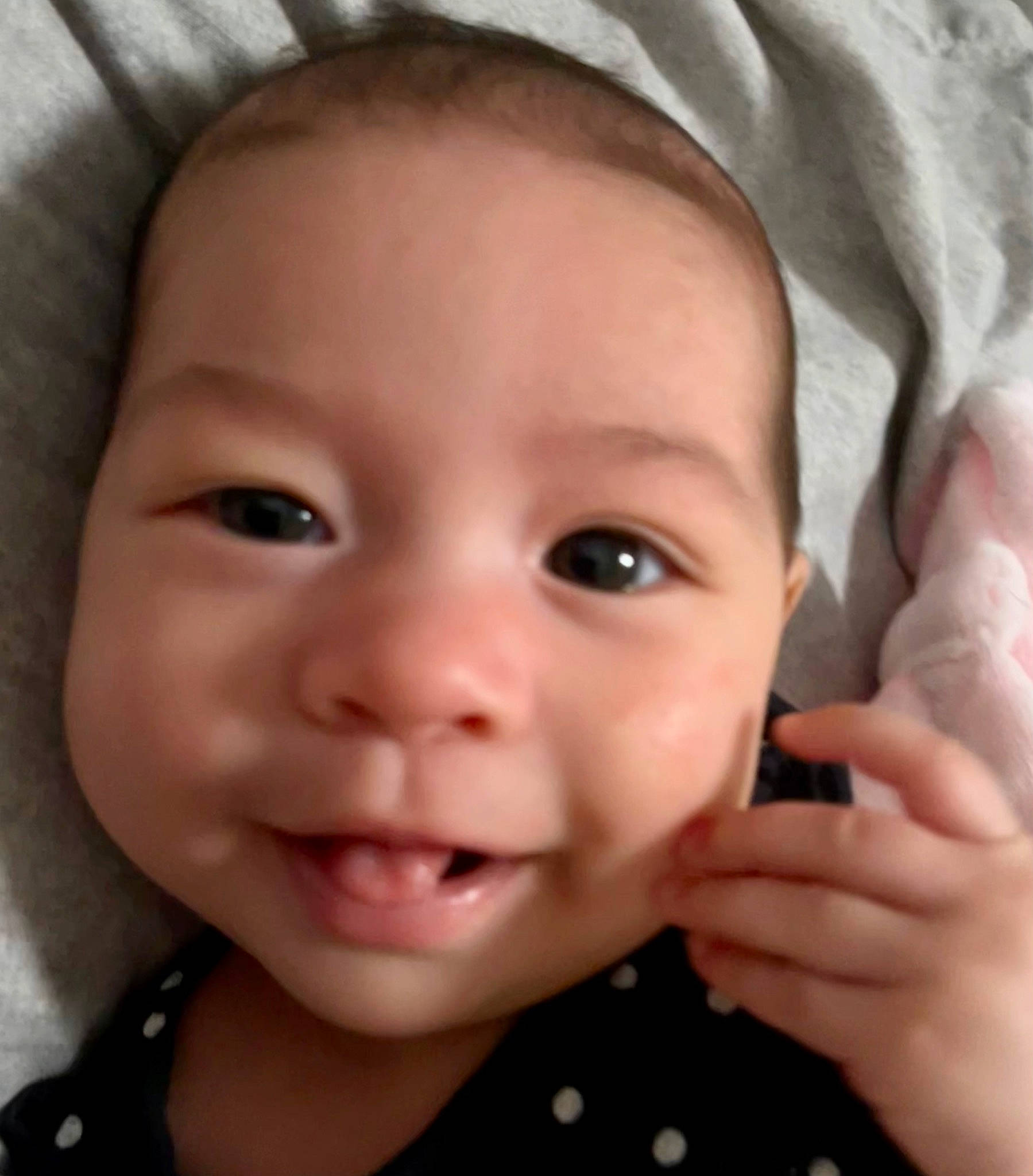 Sky is registered to the contest to win money with this photo: baby, cheek, chin, ear, eye, eyebrow, eyelash, face, finger, forehead, gesture, happy, head, iris, lip, mouth, nose, organ, person, skin