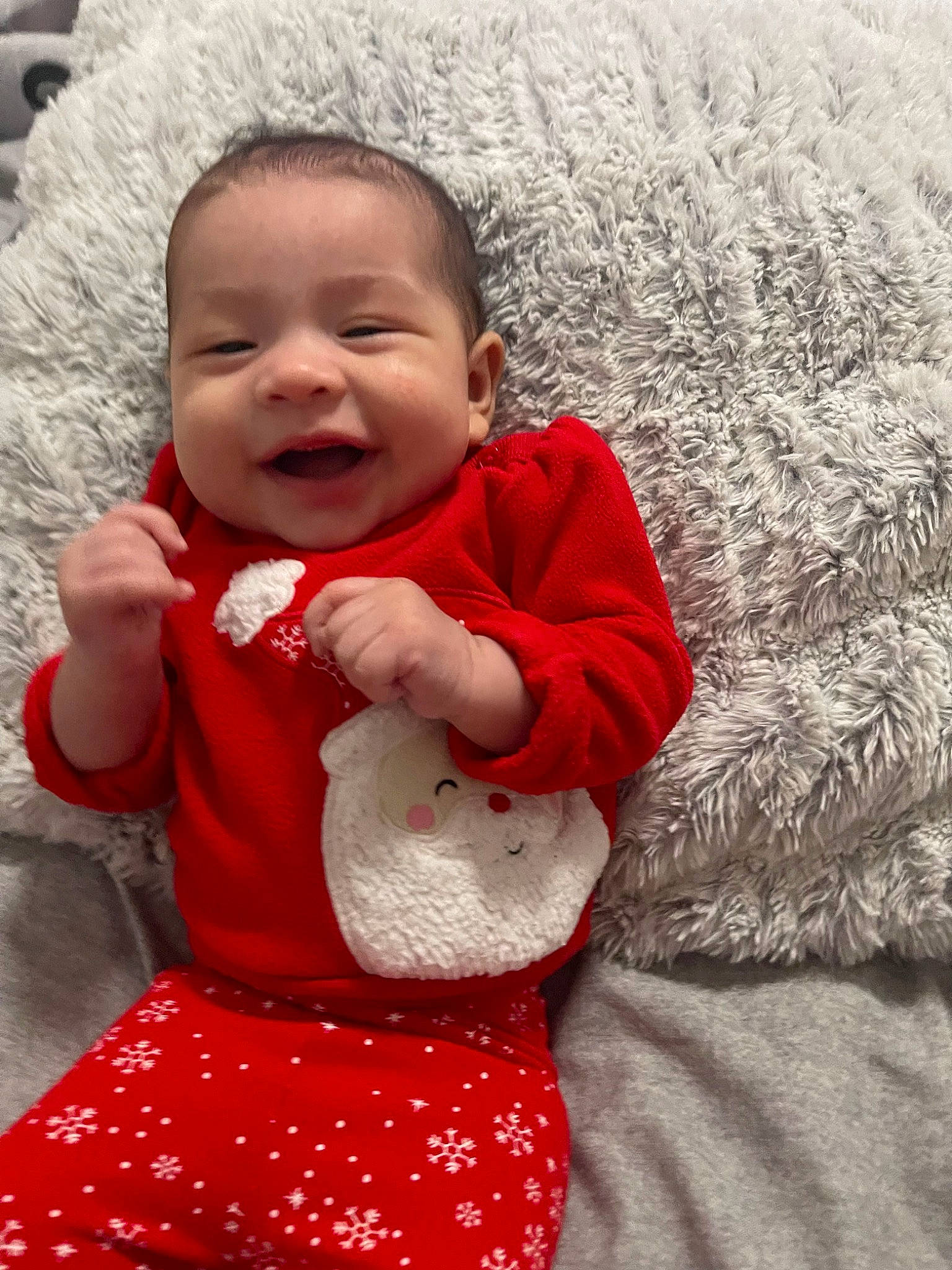 Sky is registered to the contest to win money with this photo: arm, baby, baby_toddler_clothing, beauty, comfort, eye, face, grass, happy, head, nose, organ, outerwear, pattern, person, photograph, red, skin, sleeve, smile