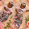 baby, blanket, child, cute, decor, fairy_lights, fashion, floral_pants, flowers, happy, headband, indoors, infant, lying_down, person, pink, portrait, smiling, soft_rug, toddler