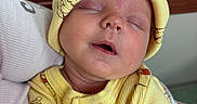 Jameson joined the competition — help win amazing prizes! baby, newborn, sleeping, yellow_clothing, hat, bear_pattern, infant, cute, peaceful, soft, portrait, child, cozy, close_up, human, resting, adorable, warm, toddler, wearing