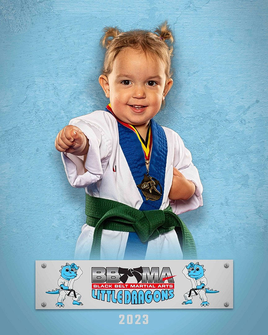 Lily is registered to the contest to win money with this photo: advertising, arm, baby, baby_toddler_clothing, electric_blue, formal_wear, gesture, happy, human_body, joy, karate, logo, martial_arts_uniform, person, photo_caption, poster, sleeve, smile, t_shirt, toddler