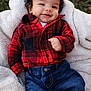 baby, infant, smile, plaid_shirt, denim, jeans, blanket, curly_hair, outdoor, grass, cute, happy, child, cozy, clothing, portrait, toddler, warm, casual_wear, person