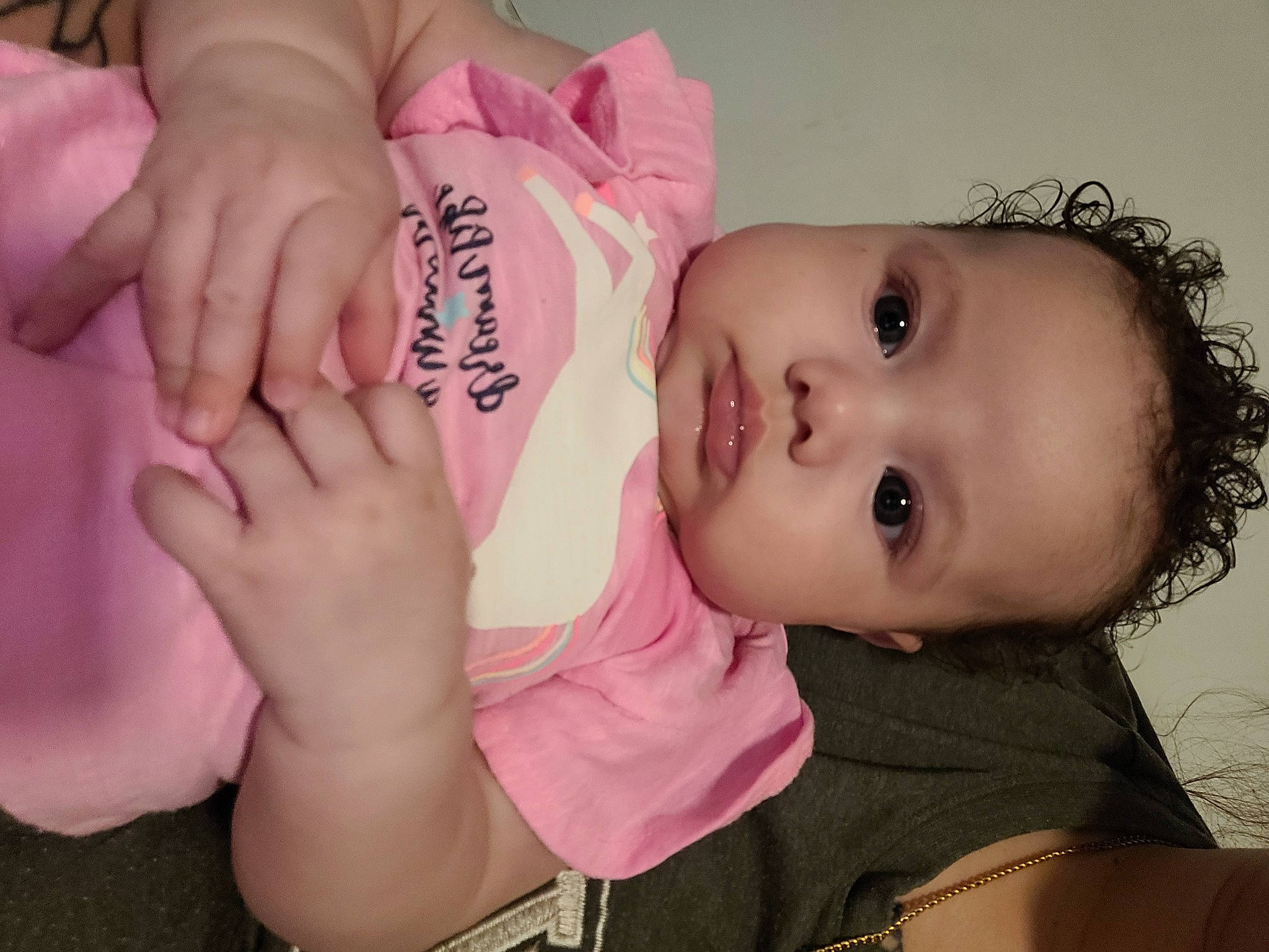 Kyriana is registered to the contest to win money with this photo: baby, baby_toddler_clothing, cheek, child, ear, eye, eyelash, finger, fun, gesture, hand, happy, lip, mouth, nail, nose, person, pink, skin, toddler