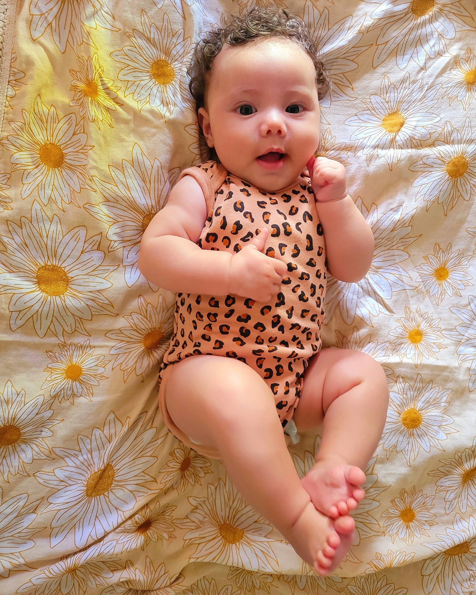 Kyriana is registered to the contest to win money with this photo: baby, baby_toddler_clothing, barefoot, brown_hair, child, day_dress, finger, foot, fun, happy, human_leg, nail, pattern, peach, people_in_nature, person, pink, sitting, skin, thigh
