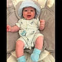 Axel joined the competition — help win amazing prizes! baby, baby_seat, blue_socks, child, clothing, cushion, cute, face, giraffe_print, happy, hat, indoor, infant, lying_down, onesie, pacifier, pattern, person, portrait, smiling