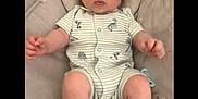 Axel joined the competition — help win amazing prizes! baby, child, chubby_cheeks, comfortable, cushion, cute, dinosaur_print, expression, indoor, infant, looking_up, onesie, pacifier, portrait, resting, seat, socks, soft_toys, striped_clothing, young_child