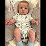 baby, child, chubby_cheeks, comfortable, cushion, cute, dinosaur_print, expression, indoor, infant, looking_up, onesie, pacifier, portrait, resting, seat, socks, soft_toys, striped_clothing, young_child