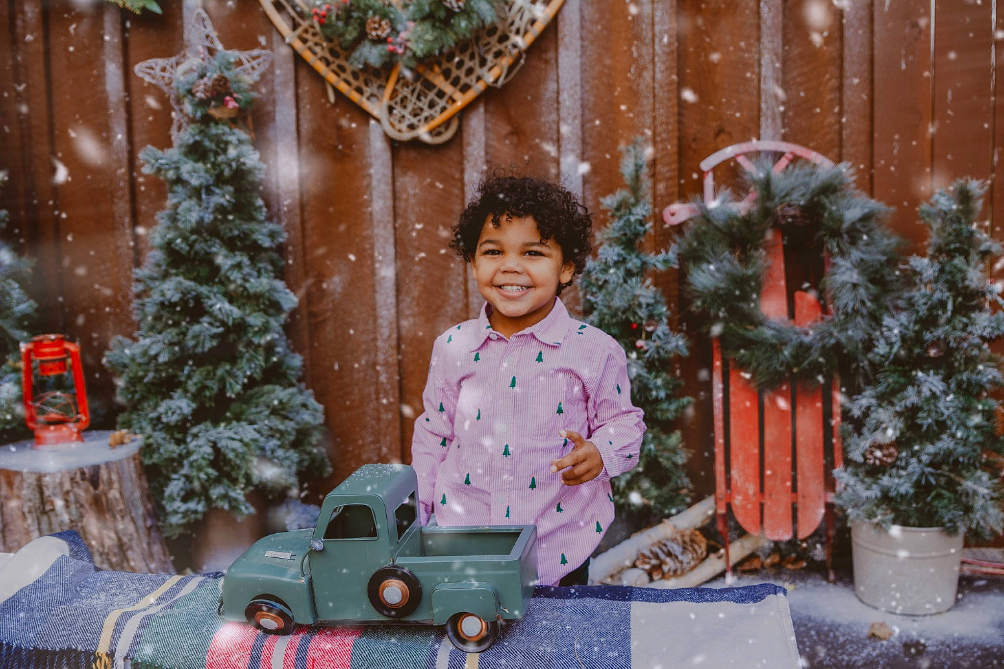 Josiah is registered to the contest to win money with this photo: christmas, christmas_decoration, christmas_eve, christmas_ornament, christmas_tree, event, flowerpot, fun, happy, holiday, joy, ornament, people, person, plant, smile, snapshot, snow, toy, tree