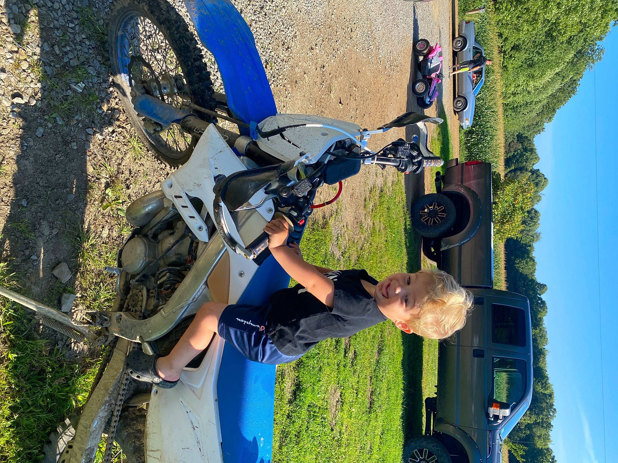 Lochlan is registered to the contest to win money with this photo: adventure, air_sports, automotive_tire, backpack, blue, electric_blue, extreme_sport, fun, grass, helmet, joy, leisure, luggage_and_bags, person, plant, recreation, sky, sports, tire, tree