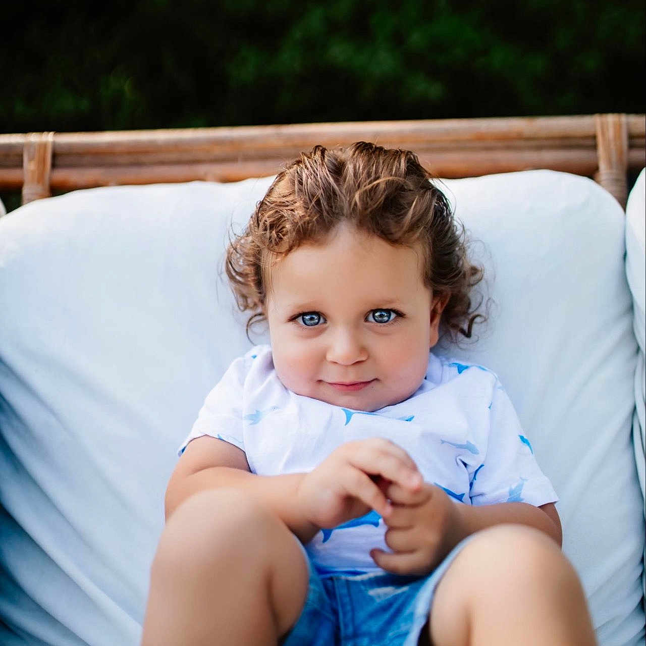 Qais is registered to the contest to win money with this photo: baby, blonde, chair, clothing, couch, cushion, face, furniture, hair, happy, head, homedecor, jeans, pants, person, photography, portrait, shorts, sitting, smile